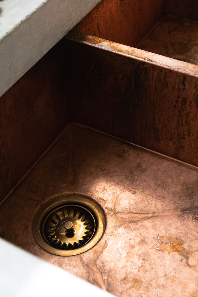 Solid Copper Sink with Concrete Drainage Slope